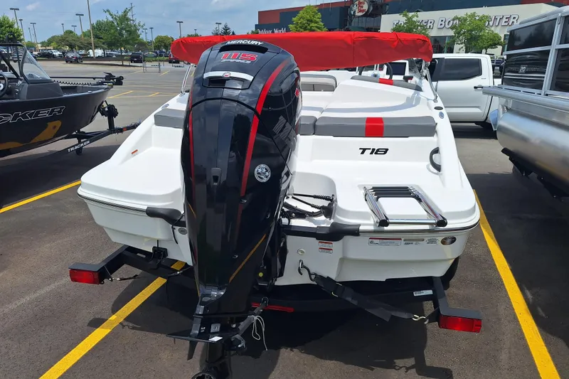 Slide: The Image of 2026 Tahoe T18 boat with Mercury 115 outboard motor in parking lot. - 7