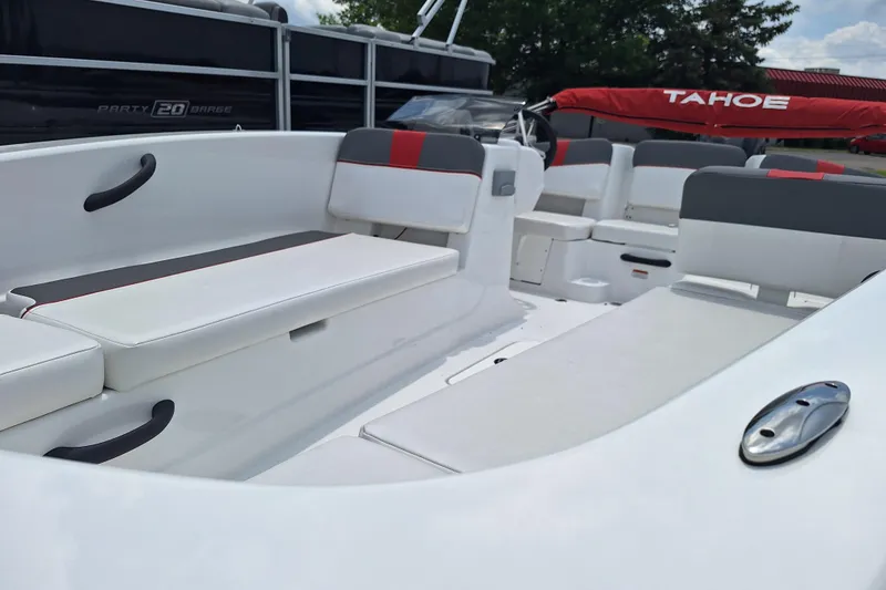 Slide: The Image of 2026 Tahoe T18 boat interior with white and gray seating, modern design. - 3
