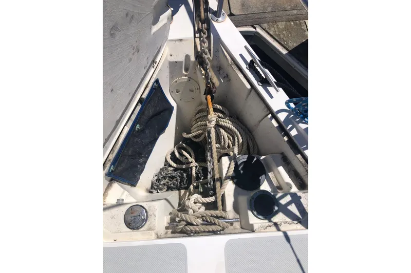 Slide: The Image of Anchor locker of a 1994 Catalina 36 MkII sailboat with ropes and chains. - 15