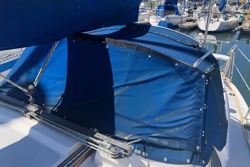 Slide: The Image of Blue canvas cover on a 1994 Catalina 36 MkII sailboat in a marina. - 21