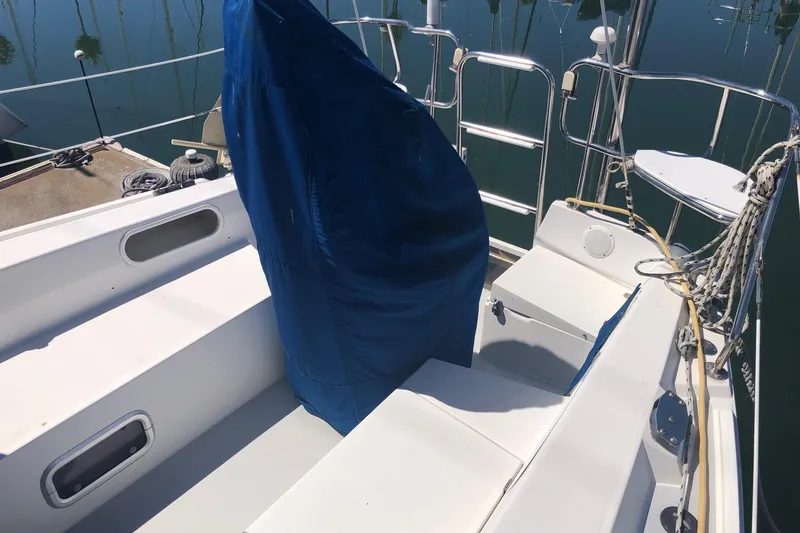 Slide: The Image of Cockpit of a 1994 Catalina 36 MkII sailboat with blue cover and ropes. - 23