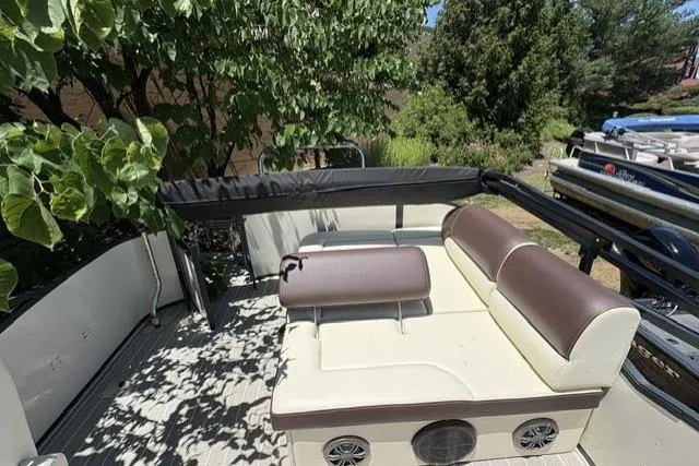 Slide: The Image of Luxurious 2022 Lexington 623 boat interior with comfortable seating and scenic outdoor view. - 6