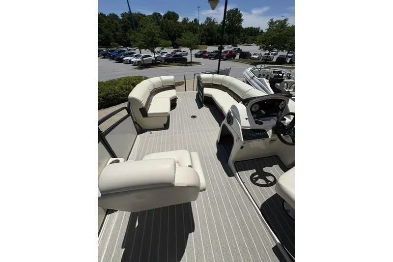 Slide: The Image of Luxurious 2022 Lexington 623 pontoon boat with spacious seating and modern helm. - 7