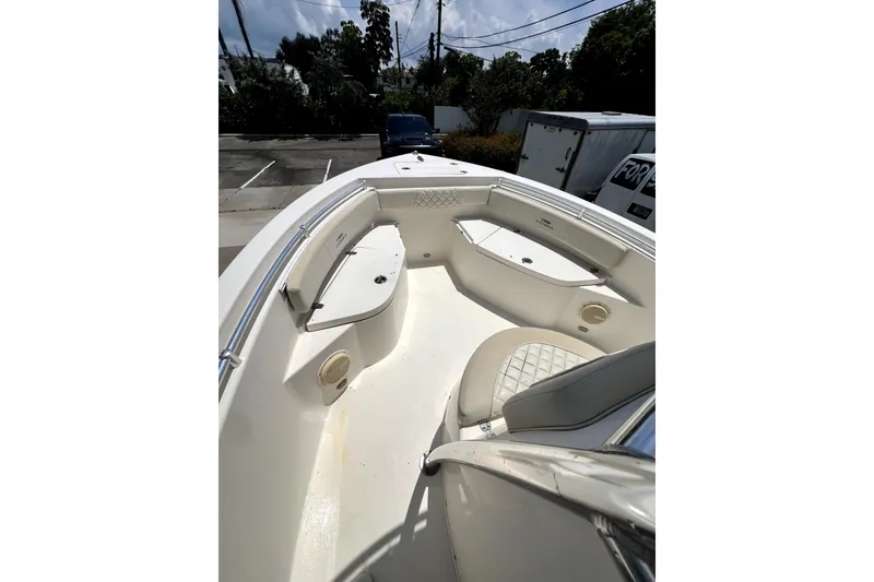 Slide: The Image of 2019 Cobia 220 Center Console boat interior with seating and storage compartments. - 14