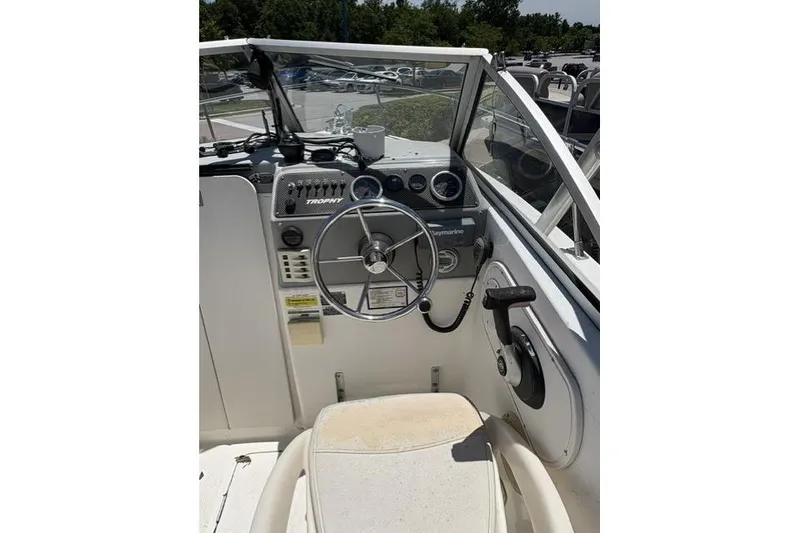 Slide: The Image of 2006 Trophy 1802 Walkaround boat cockpit with steering wheel and controls. - 4