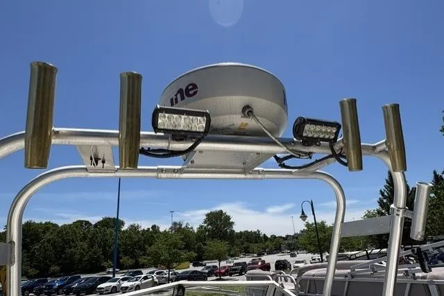 Slide: The Image of 2006 Trophy 1802 Walkaround boat radar and lights against clear blue sky. - 8