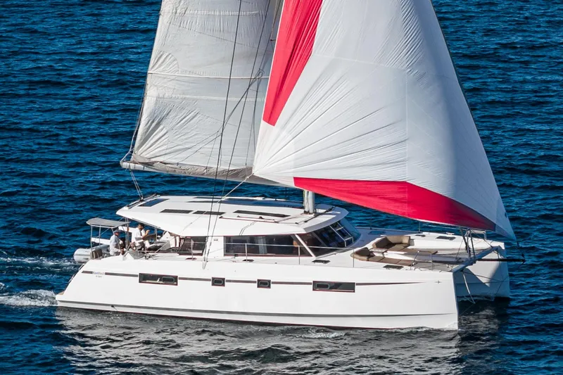 The Image of 2019 Nautitech 46 Open catamaran sailing on blue ocean waters. - 0
