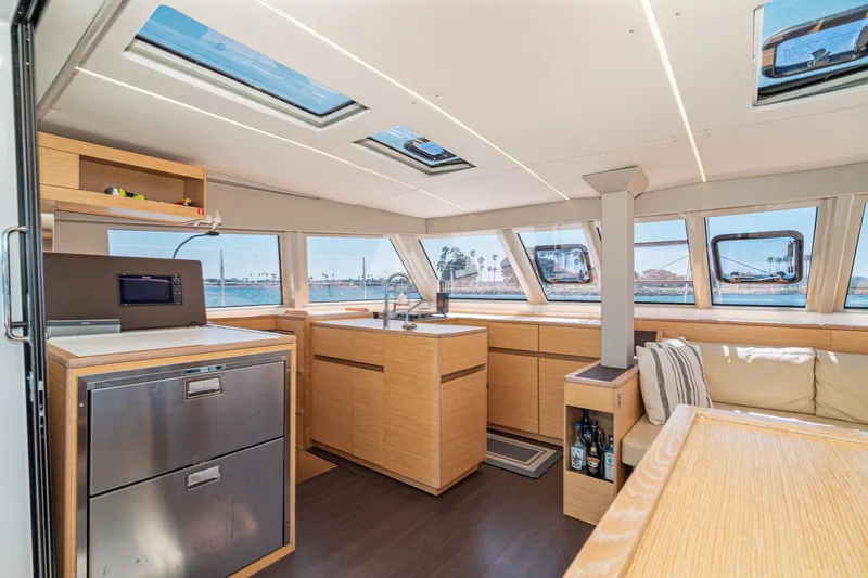 Slide: The Image of Luxurious interior of 2019 Nautitech 46 Open catamaran with modern kitchen and panoramic windows. - 13