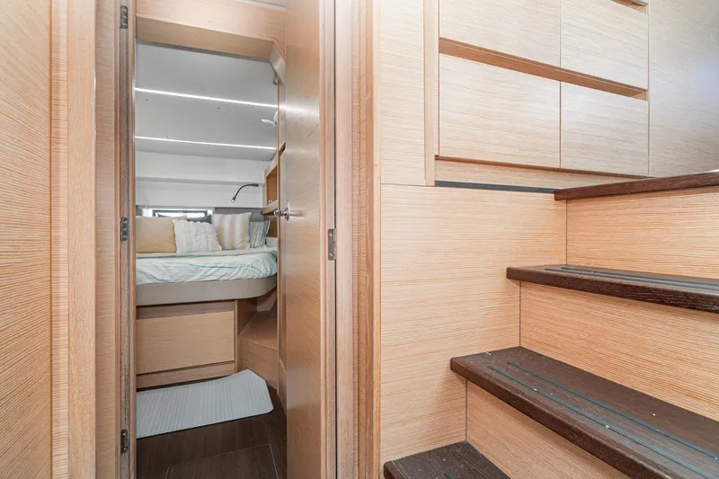Slide: The Image of Interior of 2019 Nautitech 46 Open catamaran, featuring cozy cabin and wooden staircase. - 44