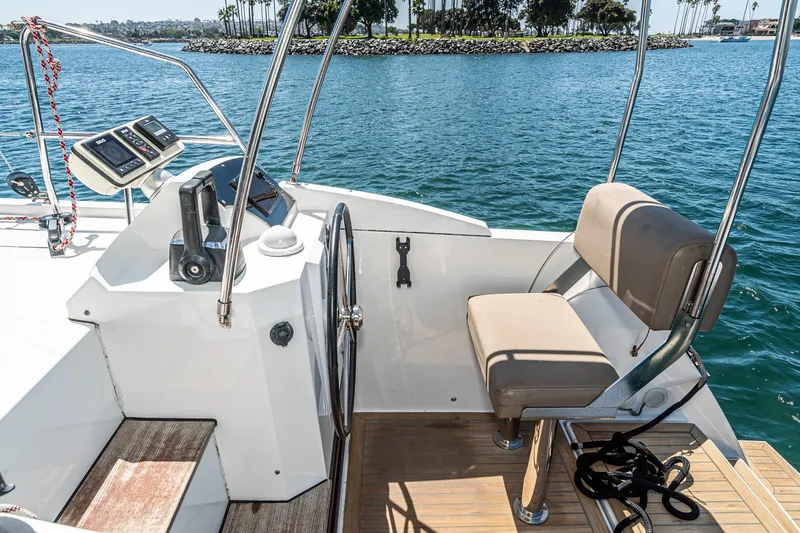Slide: The Image of Helm station of 2019 Nautitech 46 Open catamaran with steering wheel and navigation instruments. - 28