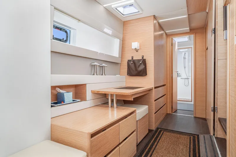 Slide: The Image of Luxurious interior of 2019 Nautitech 46 Open catamaran with modern wood finish and ample storage. - 34