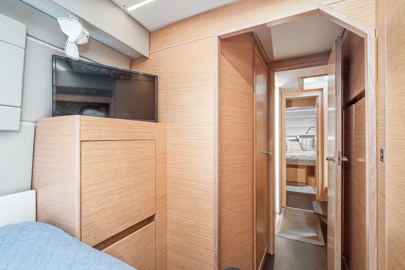 Slide: The Image of Interior of 2019 Nautitech 46 Open catamaran, featuring wood paneling and modern design. - 39