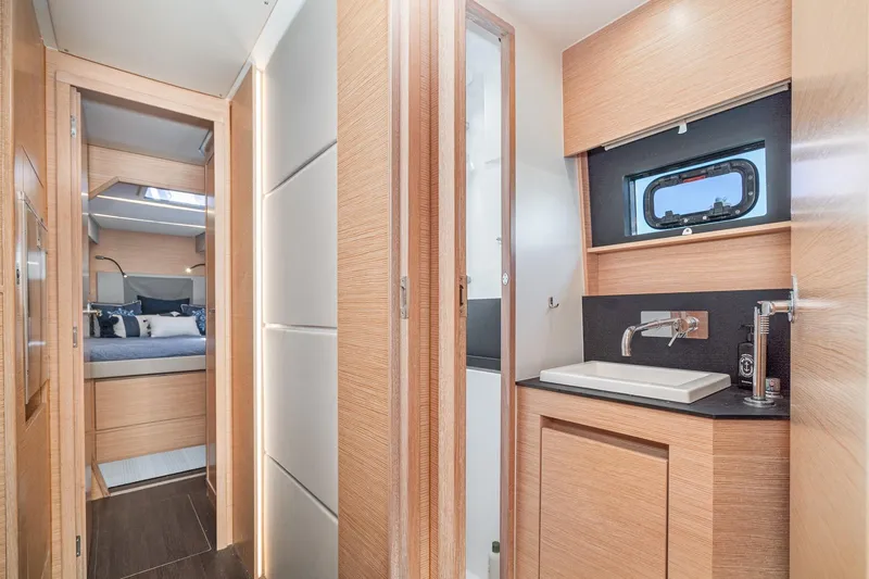 Slide: The Image of Luxurious interior of 2019 Nautitech 46 Open catamaran, featuring modern bathroom and cozy bedroom. - 40