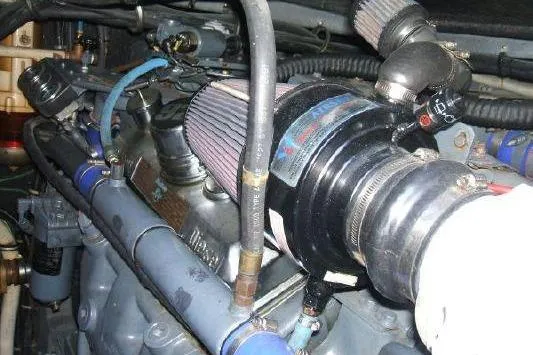 Slide: The Image of Engine compartment of a 1988 Sea Ray Sundancer 460 boat, showcasing mechanical components. - 11