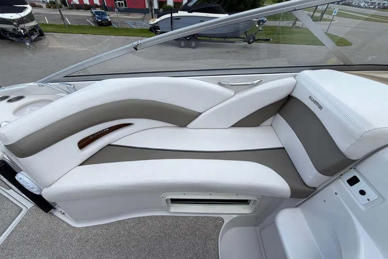 Slide: The Image of 2015 Glastron GS 289 boat interior with white and gray seating. - 12