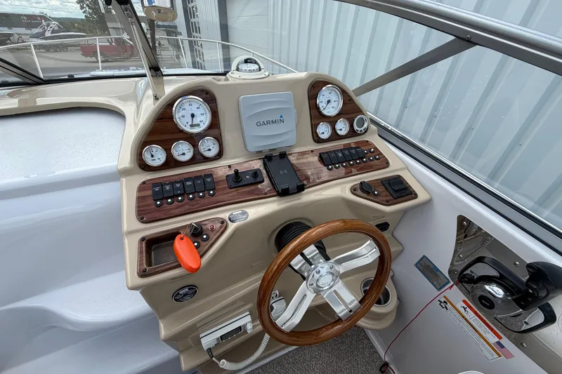 Slide: The Image of Control panel of a 2015 Glastron GS 289 boat with Garmin navigation system. - 14