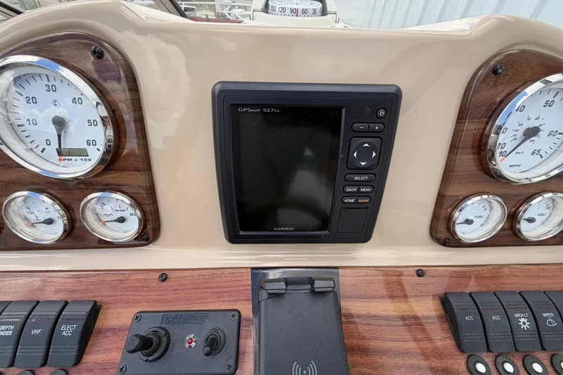 Slide: The Image of Dashboard of 2015 Glastron GS 289 boat with gauges and Garmin GPS. - 15