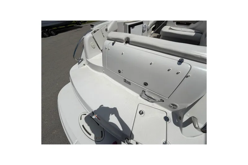 Slide: The Image of 2015 Glastron GS 289 boat deck with seating and storage compartments. - 7