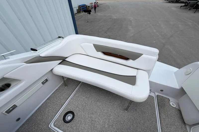 Slide: The Image of 2015 Glastron GS 289 boat interior with white and gray seating. - 9