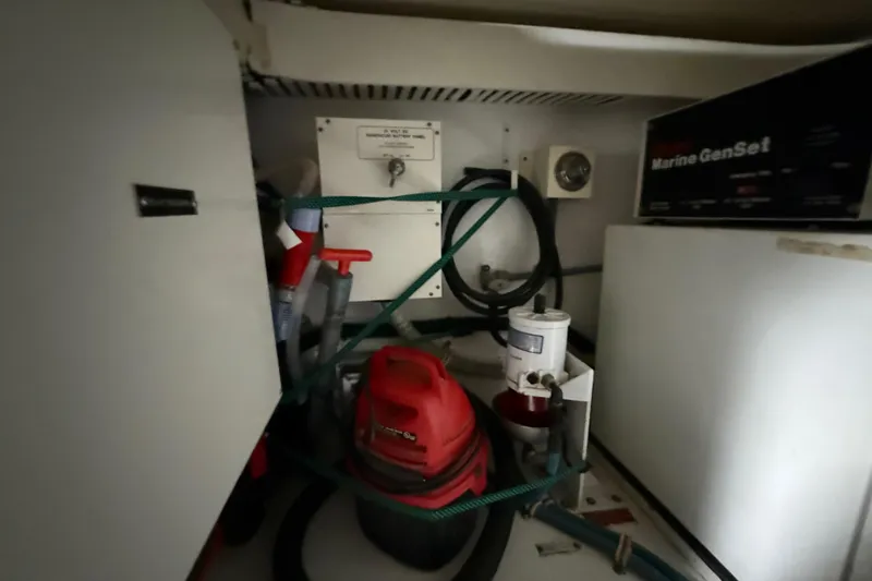 Slide: The Image of Engine room of a 1998 Hatteras yacht with Marine GenSet and equipment. - 49
