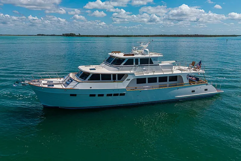 The Image of Luxury 2014 Marlow 80 Explorer yacht cruising on calm blue waters. - 0