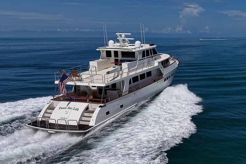 Slide: The Image of Luxurious 2014 Marlow 80 Explorer yacht cruising on open sea. - 105