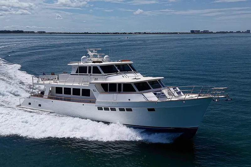 Slide: The Image of Luxury 2014 Marlow 80 Explorer yacht cruising on open water. - 112
