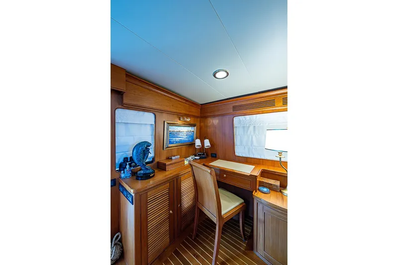 Slide: The Image of Luxurious wooden interior of 2014 Marlow 80 Explorer yacht with desk and decor. - 25