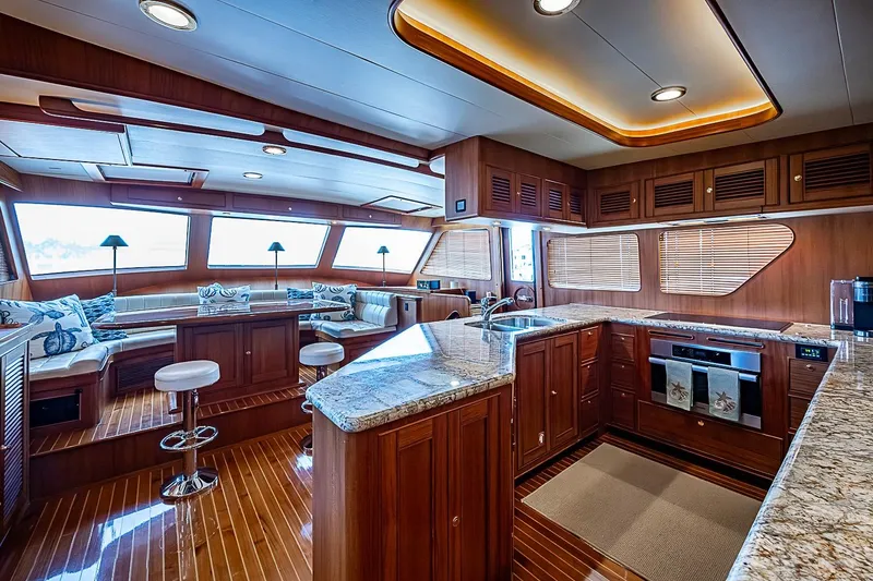 Slide: The Image of Luxurious interior of 2014 Marlow 80 Explorer yacht with elegant wood finishes and modern kitchen. - 26