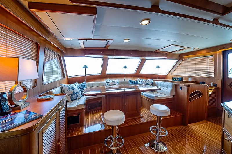 Slide: The Image of Luxurious interior of 2014 Marlow 80 Explorer yacht with elegant wood finishes and seating. - 27
