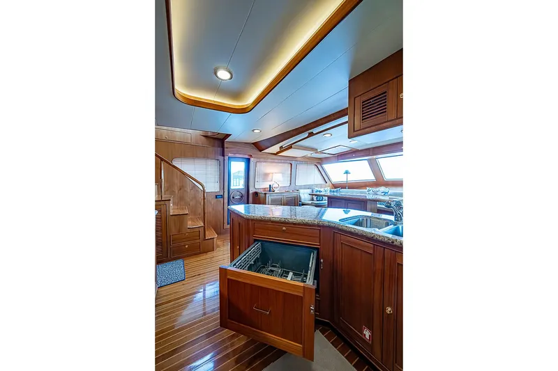 Slide: The Image of Luxurious interior of 2014 Marlow 80 Explorer yacht with modern kitchen and wooden finishes. - 31
