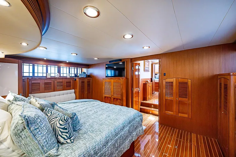Slide: The Image of Luxurious bedroom interior on 2014 Marlow 80 Explorer yacht with elegant wood finishes. - 36