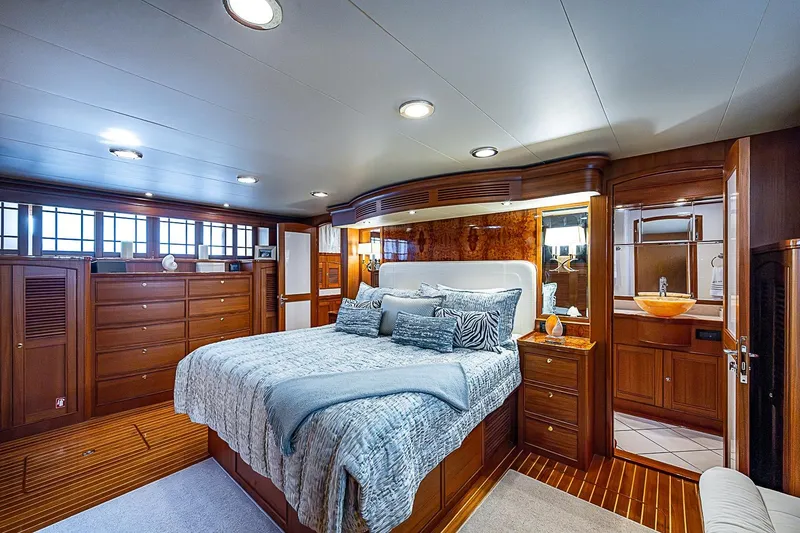 Slide: The Image of Luxurious bedroom interior of 2014 Marlow 80 Explorer yacht with elegant wood finishes. - 37