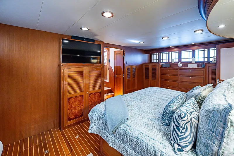 Slide: The Image of Luxurious bedroom interior of 2014 Marlow 80 Explorer yacht with elegant wood finishes. - 38