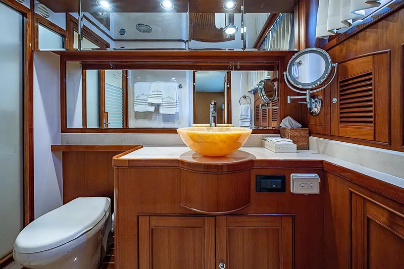 Slide: The Image of Luxurious bathroom in 2014 Marlow 80 Explorer yacht with elegant wood finishes. - 40