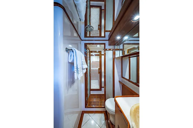 Slide: The Image of Luxurious bathroom interior of 2014 Marlow 80 Explorer yacht with elegant wood accents. - 42