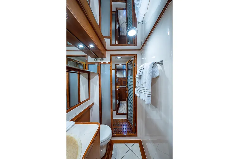 Slide: The Image of Luxurious bathroom interior of 2014 Marlow 80 Explorer yacht with wood accents and modern fixtures. - 45