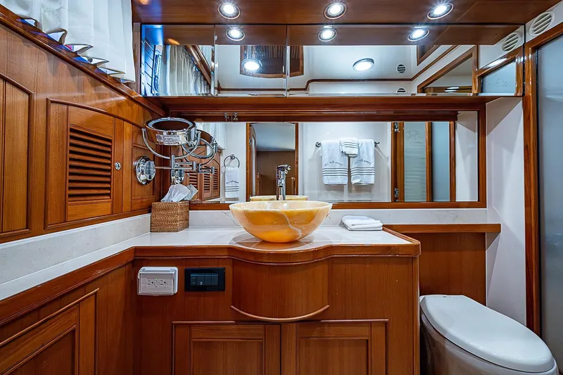 Slide: The Image of Luxurious Marlow 80 Explorer 2014 yacht bathroom with elegant wood finish and modern fixtures. - 47