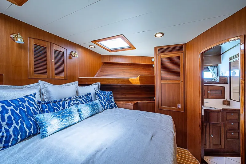 Slide: The Image of Luxurious cabin interior of 2014 Marlow 80 Explorer yacht with wood paneling and skylight. - 50
