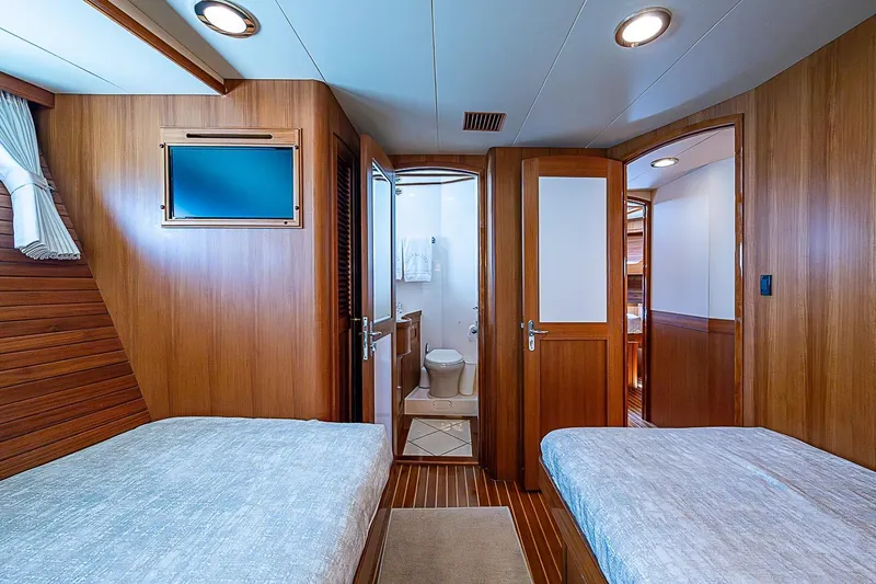Slide: The Image of Luxurious cabin interior of 2014 Marlow 80 Explorer yacht with twin beds and ensuite bathroom. - 54