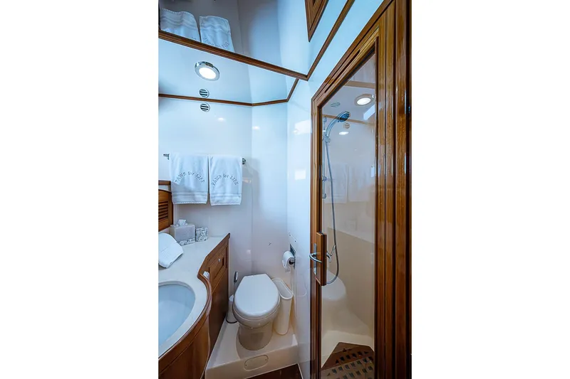 Slide: The Image of Luxurious bathroom in 2014 Marlow 80 Explorer yacht with shower and elegant wood finishes. - 57