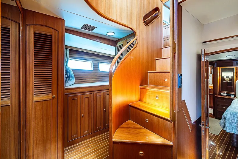 Slide: The Image of Luxurious wooden interior of 2014 Marlow 80 Explorer yacht with elegant spiral staircase. - 58