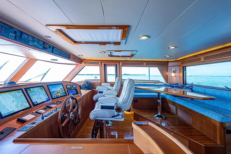 Slide: The Image of Luxurious interior of 2014 Marlow 80 Explorer yacht with navigation screens and seating area. - 6