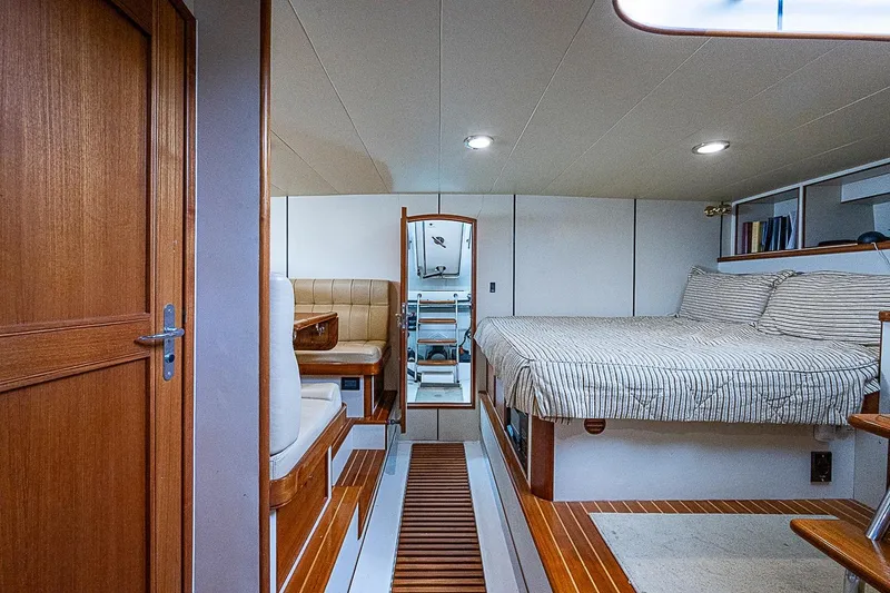 Slide: The Image of Interior of 2014 Marlow 80 Explorer yacht with cozy bed and seating area. - 63