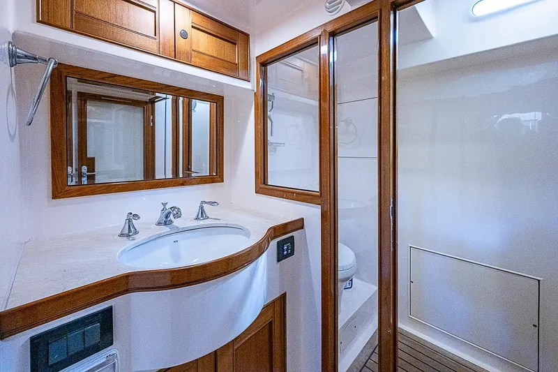 Slide: The Image of Luxurious bathroom in 2014 Marlow 80 Explorer yacht with wooden accents and modern fixtures. - 68