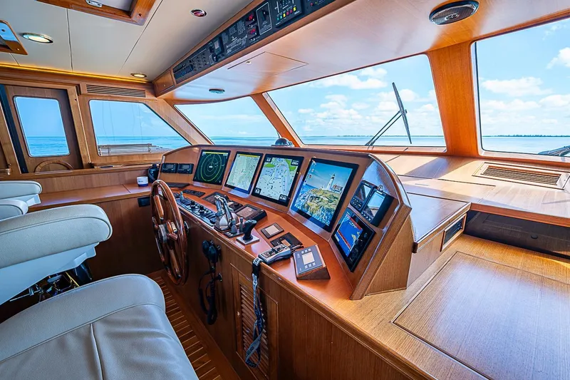 Slide: The Image of Luxurious 2014 Marlow 80 Explorer yacht cockpit with advanced navigation systems and ocean view. - 7