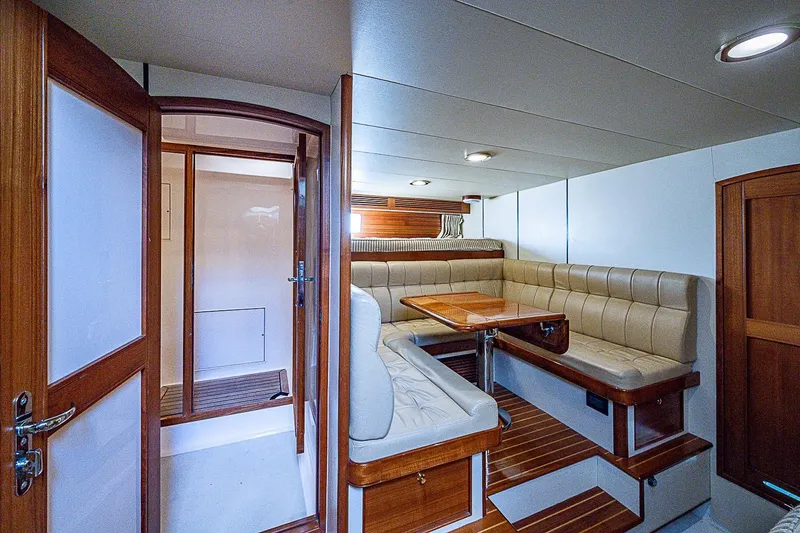 Slide: The Image of Luxurious interior of 2014 Marlow 80 Explorer yacht with elegant seating and wooden finishes. - 71