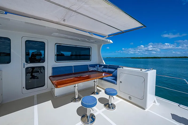 Slide: The Image of Outdoor seating area on 2014 Marlow 80 Explorer yacht with ocean view. - 74