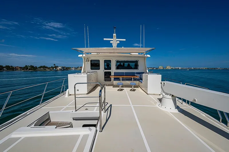 Slide: The Image of 2014 Marlow 80 Explorer yacht deck with ocean view and seating area. - 77