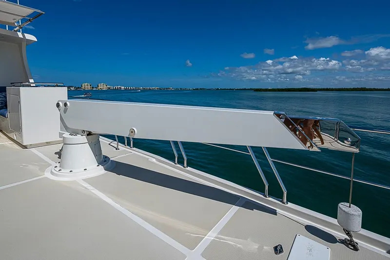 Slide: The Image of Deck view of 2014 Marlow 80 Explorer yacht with clear blue sky and ocean. - 78